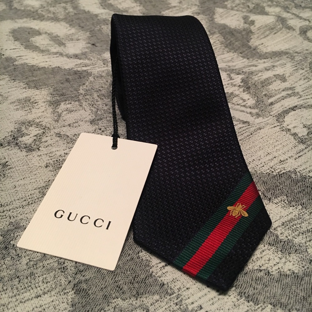 Gucci silk tie in navy blue. New. Never worn.